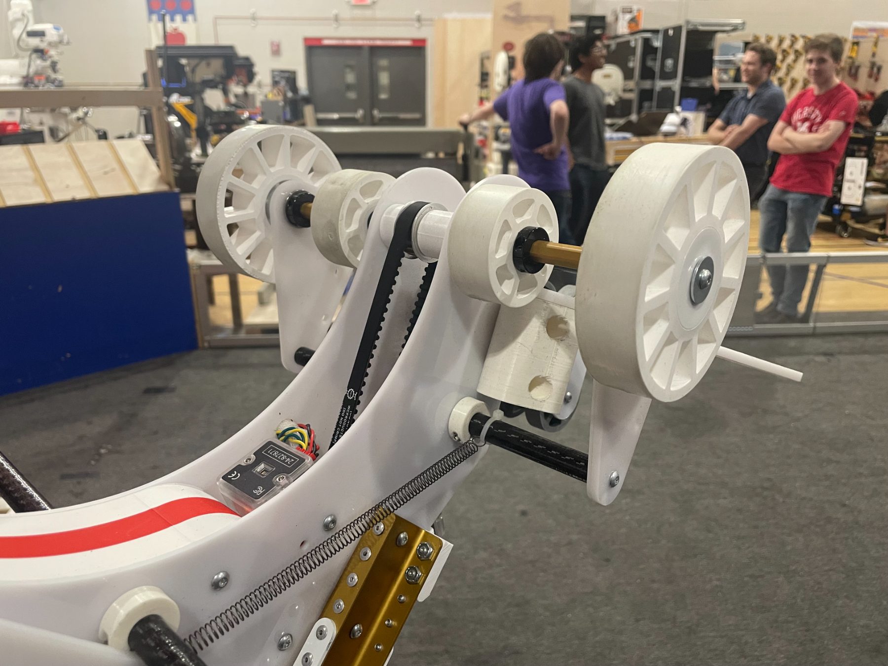 Close-up of the arm pulleys and belt drive